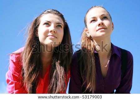 Two young women looking ahead