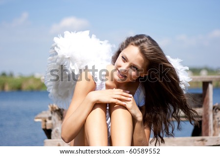 Pretty woman with angel wings