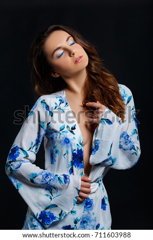 Portrait Of An Attractive Brunette Woman Wearing A White Nightshirt In Front Of Black Studio Portrait Of An Attractive Brunette Woman Wearing A White Nightshirt In Front Of Black Studio