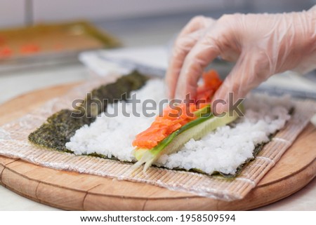 Similar – Image, Stock Photo Crop chef preparing sushi at table in restaurant