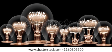 Photo of light bulb with shining fibers in shapes of CAREER concept related words isolated on black background Сток-фото © 