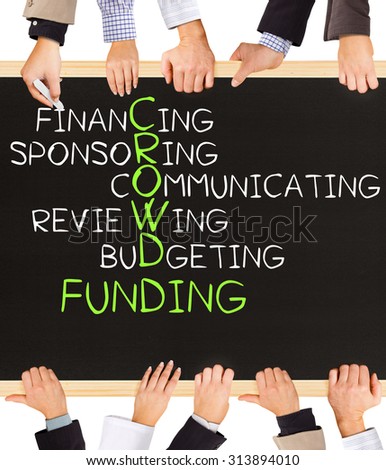 Photo of business hands holding blackboard and writing CROWD FUNDING concept