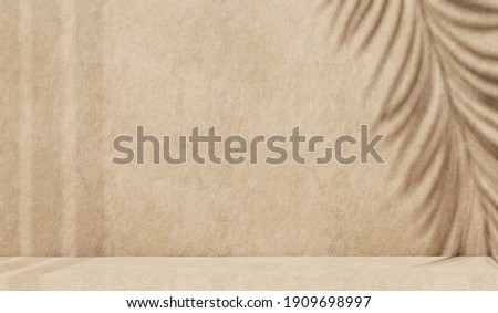 Minimal abstract concrete texture background for cosmetic product presentation. Premium podium with tropical palm leaf shadow on beige natural stone wall. Realistic 3d rendering