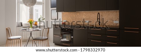 Panorama of modern kitchen with stylish black cupboards and drawers, copper hexagonal tiles and handles and with new black dining table and two, elegant copper chairs