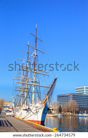GDYNIA, POLAND-MARCH 18: Polish training tall ship Dar Pomorza on the background of the city of Gdynia on March 18, 2015 in Gdynia,Poland. Gdynia is a port city, the organizer of the Tall Ships\' Races