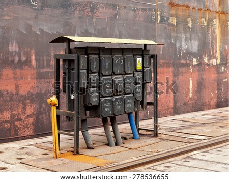 Electrical equipment at a switching board in shipyard.