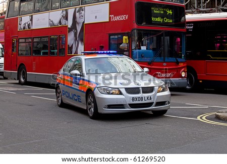 LONDON, ENGLAND - SEPTEMBER 15: Police car with blue lights answering emergency call in London on 15 September 2010.