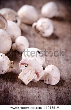Mushrooms on wooden background