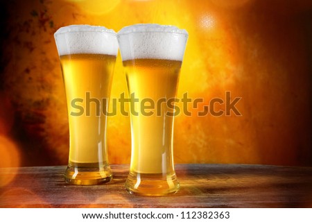 Beer glasses with gold background