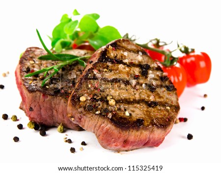 Grilled bbq steaks on white background