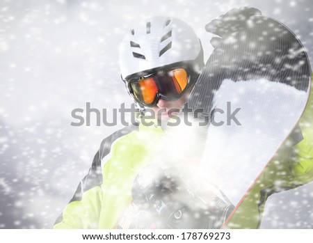 Snowboarder portrait with falling snow