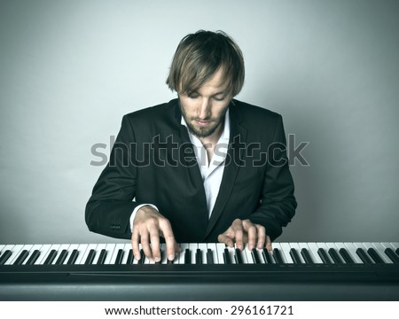 Close-up of pianist playing the piano.