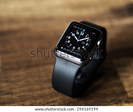PRAGUE, CZECH REPUBLIC - June 22, 2015: New wearable Apple Watch smartwatch displaying the Home screen. Apple Watch has fitness tracking and health-oriented capabilities with iOS products.