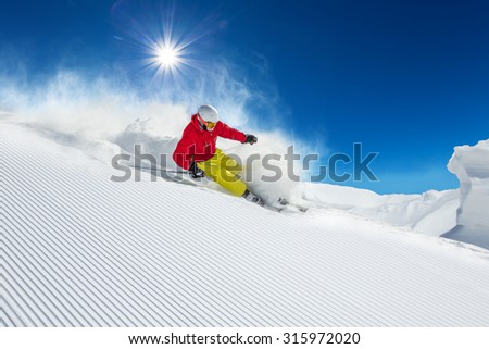 Similar – Image, Stock Photo Skier with red jacket and green backpack in icy snowy landscape walks on lonely ski track on way to mountain in evening light