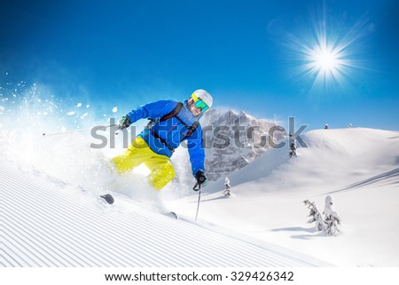 Similar – Image, Stock Photo Skier with red jacket and green backpack in icy snowy landscape walks on lonely ski track on way to mountain in evening light