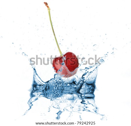 Cherry dropped into water splash on white