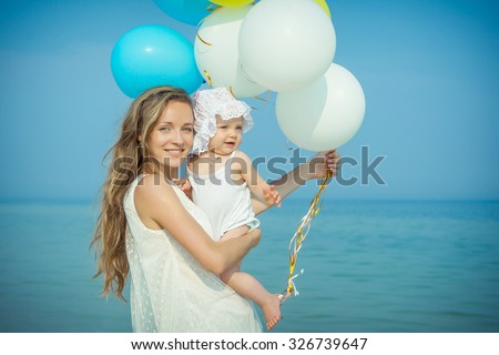Happy family. Mother and her daughter having fun on the beach. Positive human emotions, feelings, emotions.