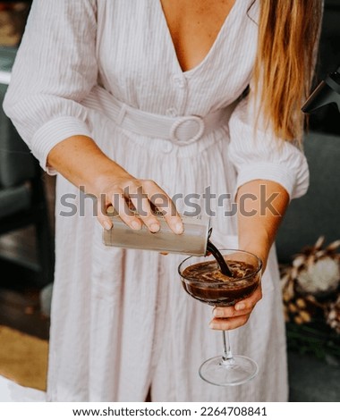 Similar – Image, Stock Photo Woman pouring cocktail in metal mug