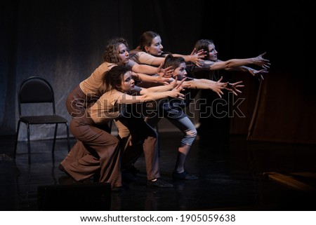 Actors and actresses play a modern lyrical performance of the theater stage show