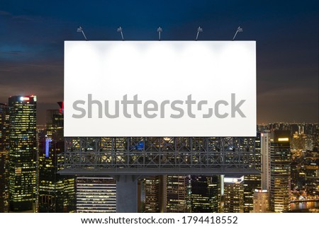 Blank white road billboard with Singapore cityscape background at night time. Street advertising poster, mock up, 3D rendering. Front view. The concept of marketing communication to sell idea. Stock foto © 
