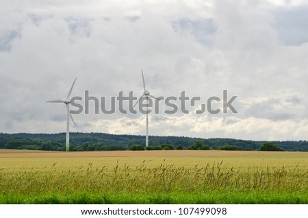 wind power station, field and stormy weather conditions