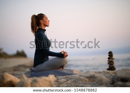 Similar – Image, Stock Photo Serene ethnic woman meditating during aromatherapy at home