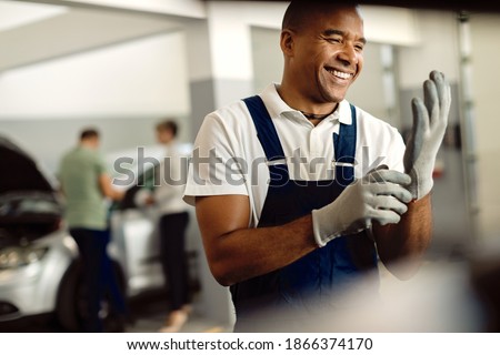 Similar – Image, Stock Photo Mechanic putting on protective mask in workshop