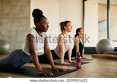 Similar – Image, Stock Photo Young focused ethnic sportswoman on street before training