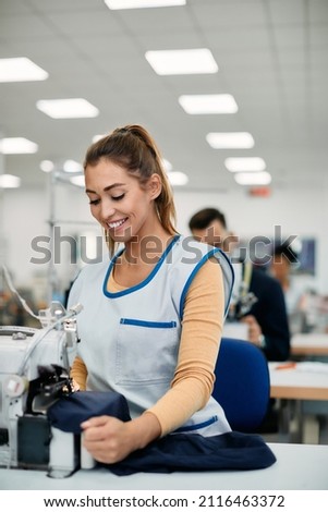 Similar – Foto Bild Arbeitende Frau bei der Kontrolle von Textilfabriken