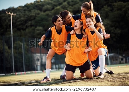 Similar – Image, Stock Photo Young female soccer player practicing on field.