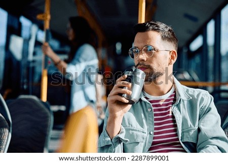 Similar – Image, Stock Photo Pensive young man in black studio with smoke