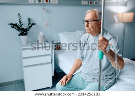 Similar – Image, Stock Photo Pensive senior male sitting on floor with cup of tea