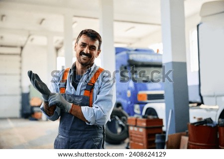 Similar – Image, Stock Photo Mechanic putting on protective mask in workshop