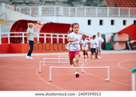 Similar – Image, Stock Photo Little child jumping from a boat with a blue sky background