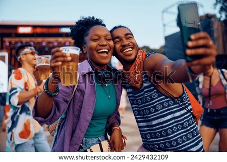 Similar – Image, Stock Photo Happy African American female taking selfie near sea