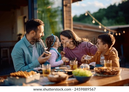 Similar – Image, Stock Photo Happy family on a camping trip relaxing in the autumn forest. Camper trailer. Fall season outdoors trip