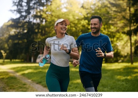 Similar – Image, Stock Photo Athletic woman in the gym lifting weights in the gym