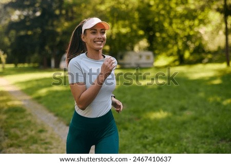 Similar – Image, Stock Photo Athletic woman in the gym lifting weights in the gym