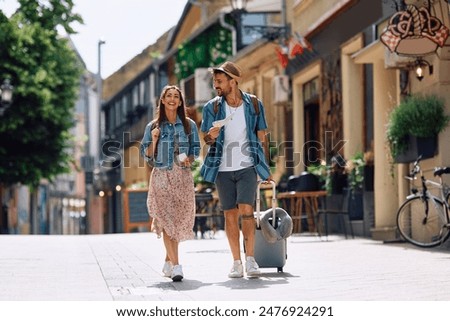 Similar – Image, Stock Photo Couple of travelers on hill in mountains