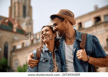 Similar – Image, Stock Photo Couple of travelers on hill in mountains