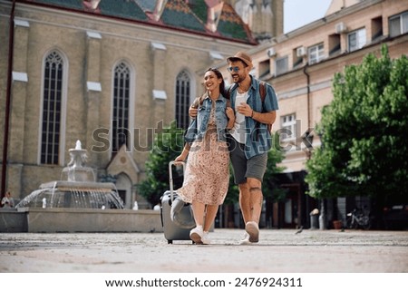 Image, Stock Photo Happy couple walking on sea