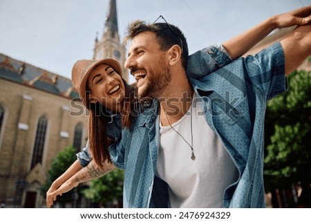 Similar – Image, Stock Photo Traveler enjoying freedom while standing on hilltop and observing wide highland