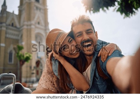 Similar – Image, Stock Photo Happy young couple embracing near weathered building