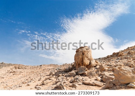 Beautiful Desert Landscape of Egypt. Yellow sand, mountains, clouds and blue sky.