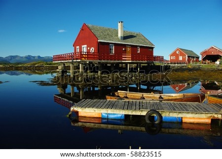 Houses on the sea coast and boats