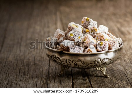 Turkish delight in hollowware, traditional turkish sweet double roasted with pistachio nuts and coconut Foto d'archivio © 
