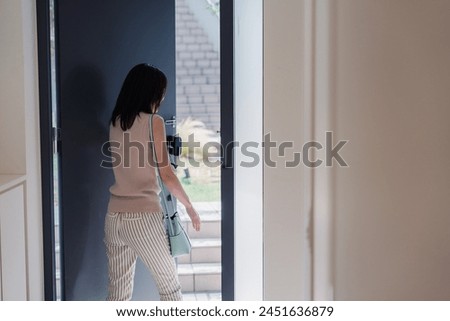 Similar – Image, Stock Photo A young woman leaving the airport with her luggage at her destination