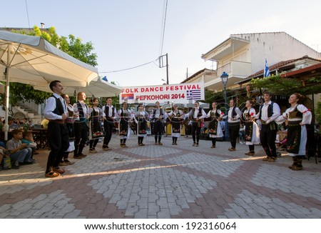 Pefkohori,Greece-May 11 2014 : Folk Dancers taking part in the Anual Folk Dance festival in the village square of Pefkohori,Greece