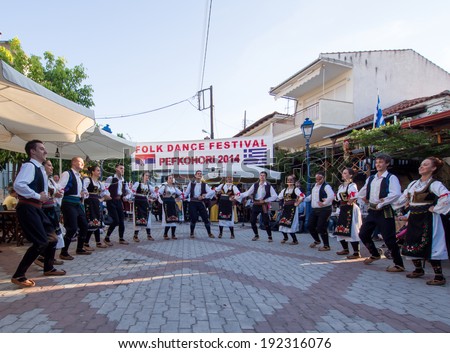 Pefkohori,Greece-May 11 2014 : Folk Dancers taking part in the Anual Folk Dance festival in the village square of Pefkohori,Greece