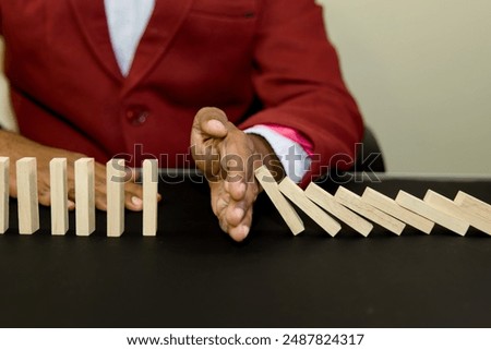 Similar – Image, Stock Photo The wooden domino blocks falling down